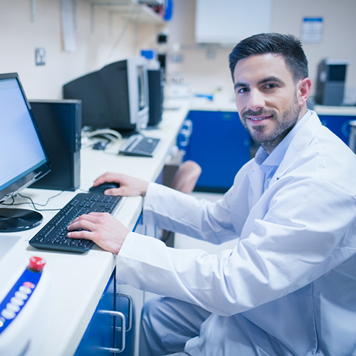 Image of IT manager working with pathologist and lab manager in the lab